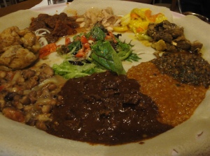 Chef's mixed platter served on a bed of Injera bread