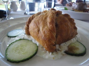 Butter puff pastry filled a with spiced chicken farce served on a cucumber and yoghurt sauce